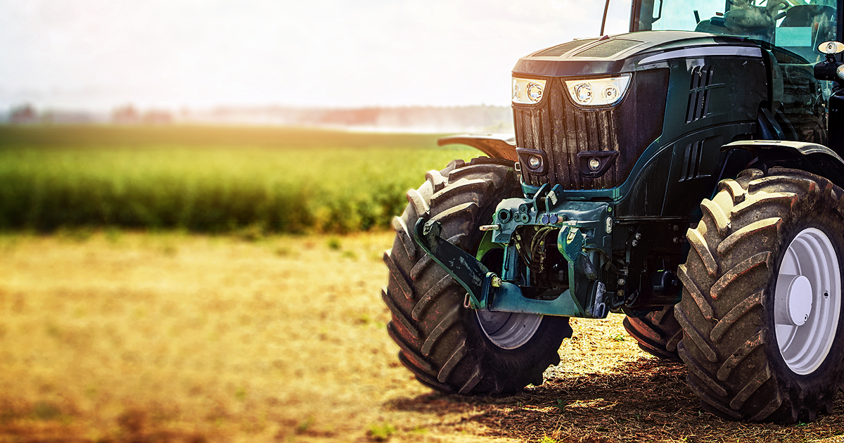 Photo of a green tractor in a field